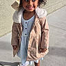 child, girl, smiling, outdoor, portrait, sunhat, fashion, coat, dress, sandals, sidewalk, sunlight, street, standing, happy, facial_expression, curly_hair, photography, summer, shadows
