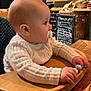 baby, bodypart, computerhardware, electronics, face, finger, furniture, hand, hardware, hardwood, head, monitor, person, photography, plywood, portrait, screen, sitting, table, wood