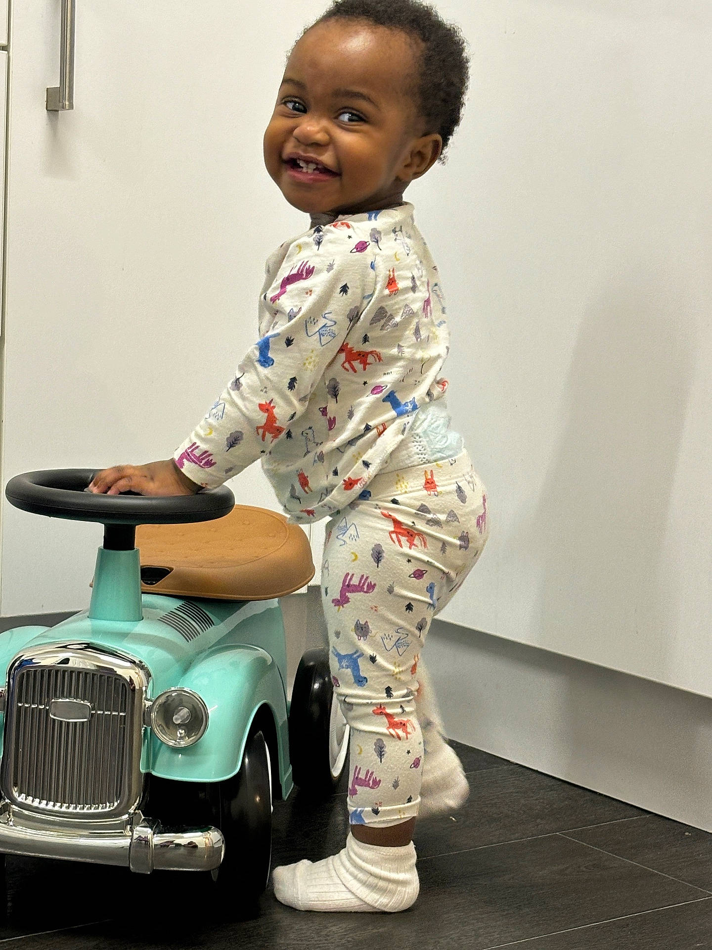 Sharonda joined the competition — help win amazing prizes! boy, car, child, clothing, face, footwear, happy, head, machine, male, pajamas, person, photography, portrait, shoe, sitting, smile, transportation, vehicle, wheel