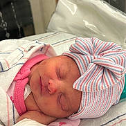 Juniper joined the competition — help win amazing prizes! newborn, baby, sleeping, hat, bow, blanket, hospital, infant, cute, peaceful, wrapped, closeup, face, soft, clothing, pink, striped, headwear, resting, toddler