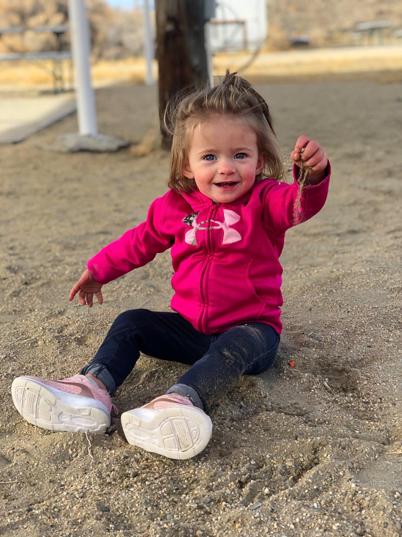 Kaylyn is registered to the contest to win money with this photo: child, fun, grass, happy, joy, landscape, leisure, magenta, morning, people_in_nature, person, pink, recreation, shoe, sitting, smile, sneakers, soil, sunlight, toddler