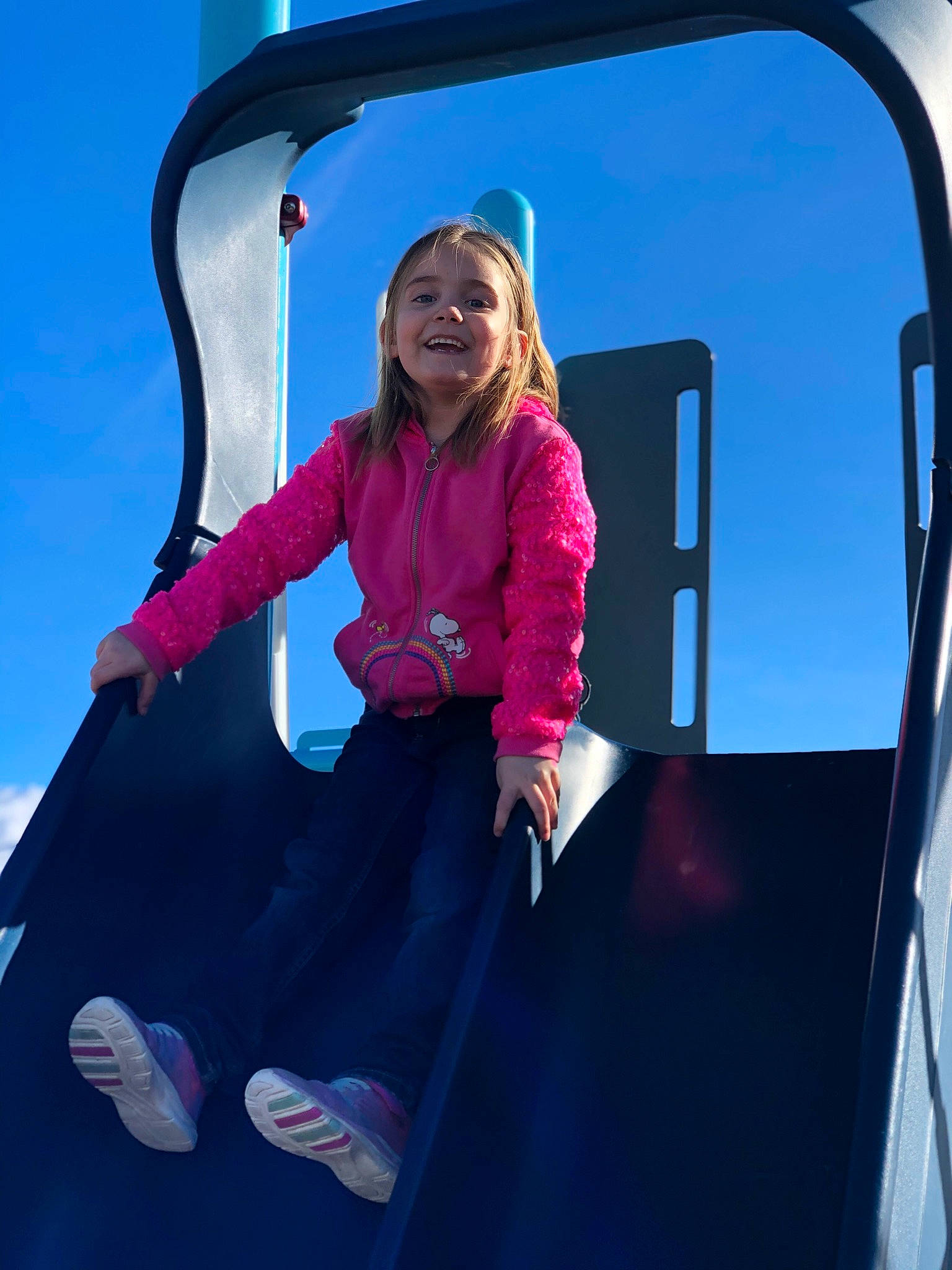 Rhyllie joined the competition — help win amazing prizes! city, electric_blue, fun, happy, jacket, joy, leisure, magenta, outdoor_play_equipment, person, pink, purple, recreation, sky, smile, snapshot, stairs, standing, t_shirt, toddler
