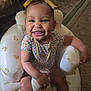 Katalaya joined the competition — help win amazing prizes! baby, bear_pattern, carpet, child, clothing, cup, cute, furniture, hand, happy, home, indoor, inflatable_chair, person, portrait, sitting, smiling, toddler, tongue_out, yellow_bow