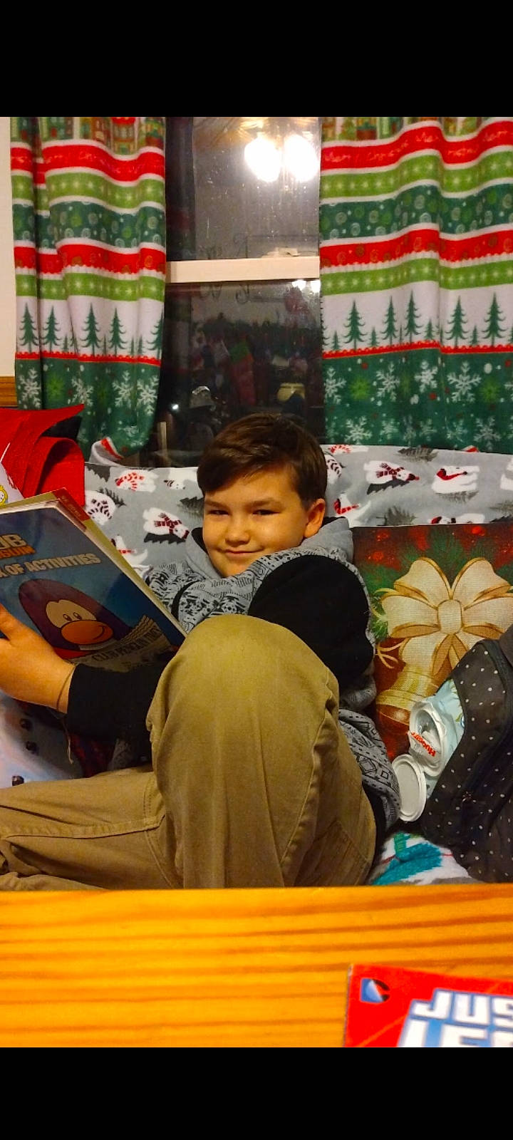 Logen joined the competition — help win amazing prizes! art, child, christmas, christmas_ornament, curtain, event, fun, happy, holiday, joy, lap, leisure, linens, person, product, room, smile, toddler, travel, tree