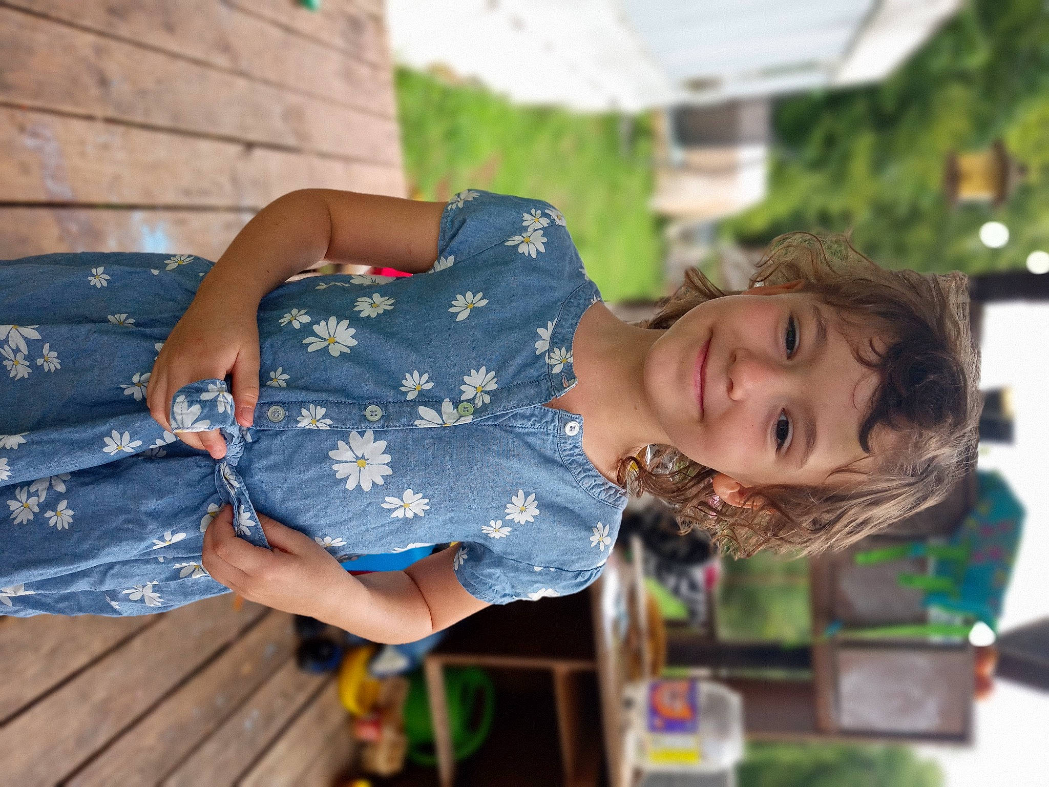 Nevaeh is registered to the contest to win money with this photo: child, dress, electric_blue, fun, grass, happy, hat, human_leg, joy, leisure, pattern, person, plant, recreation, sitting, smile, tree, vacation