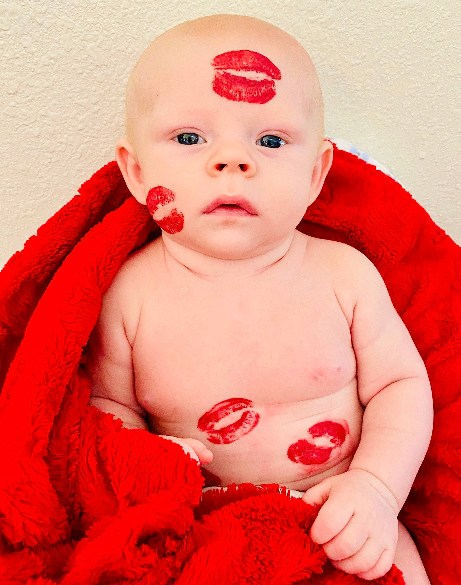 Bubby is registered to the contest to win money with this photo: baby, baby_making_funny_faces, cheek, child, face, finger, flesh, head, headwear, lip, mouth, nose, person, red, skin, textile, toddler