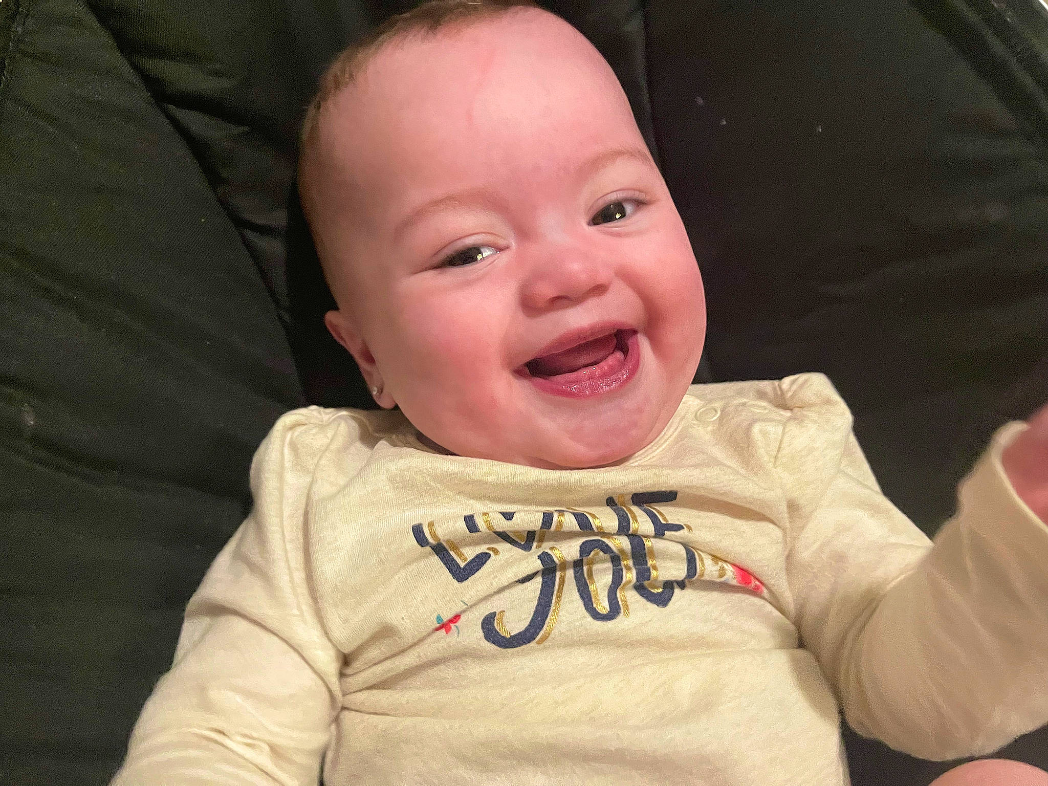Amalia is registered to the contest to win money with this photo: baby, baby_toddler_clothing, cheek, child, chin, comfort, eye, eyebrow, face, finger, gesture, happy, head, lip, mouth, nose, person, sleeve, smile, t_shirt