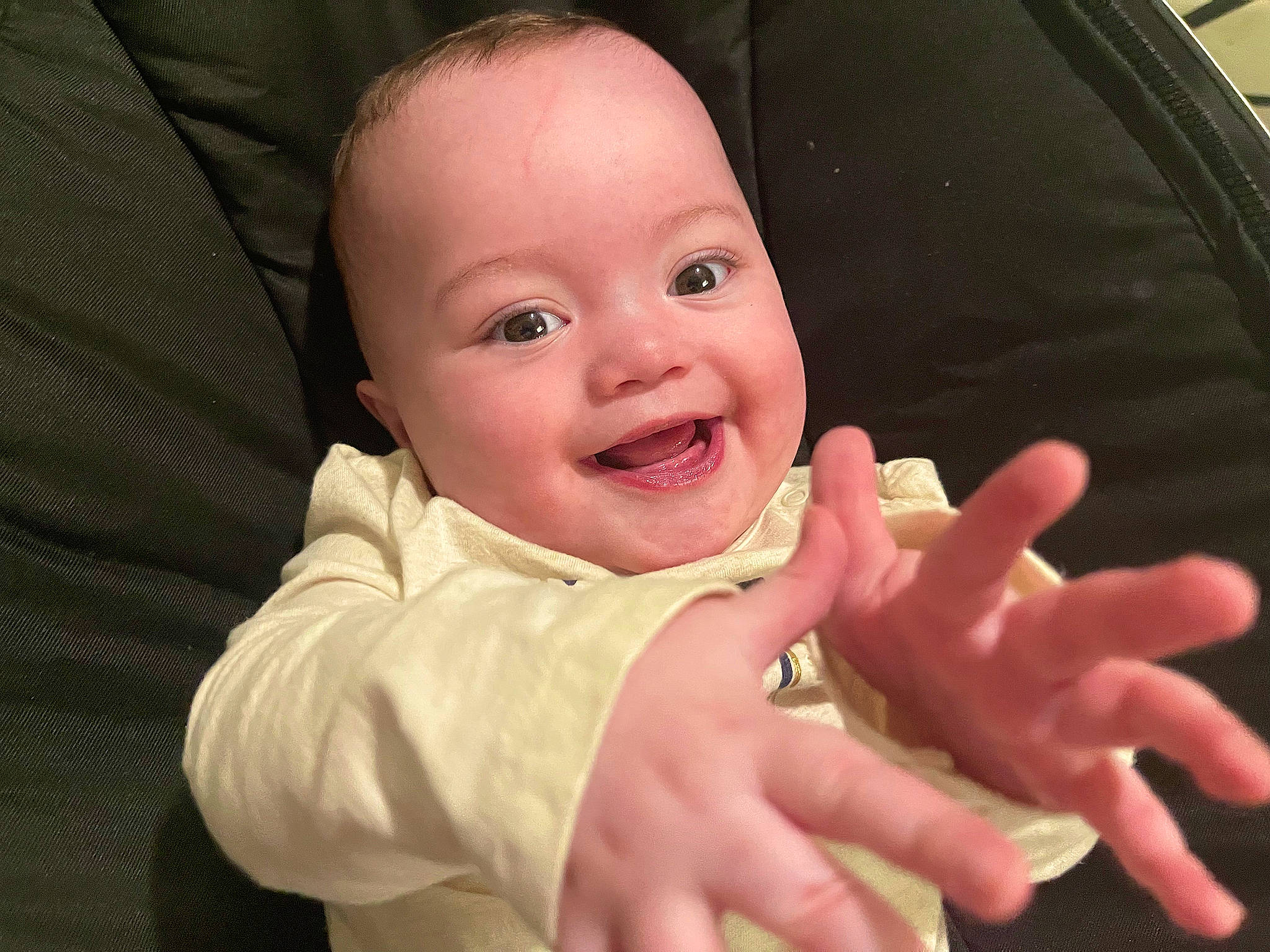 Amalia is registered to the contest to win money with this photo: baby, cheek, comfort, eye, finger, fun, gesture, happy, human_body, lip, mouth, nail, nose, person, sign_language, skin, sleeve, smile, thumb, toddler