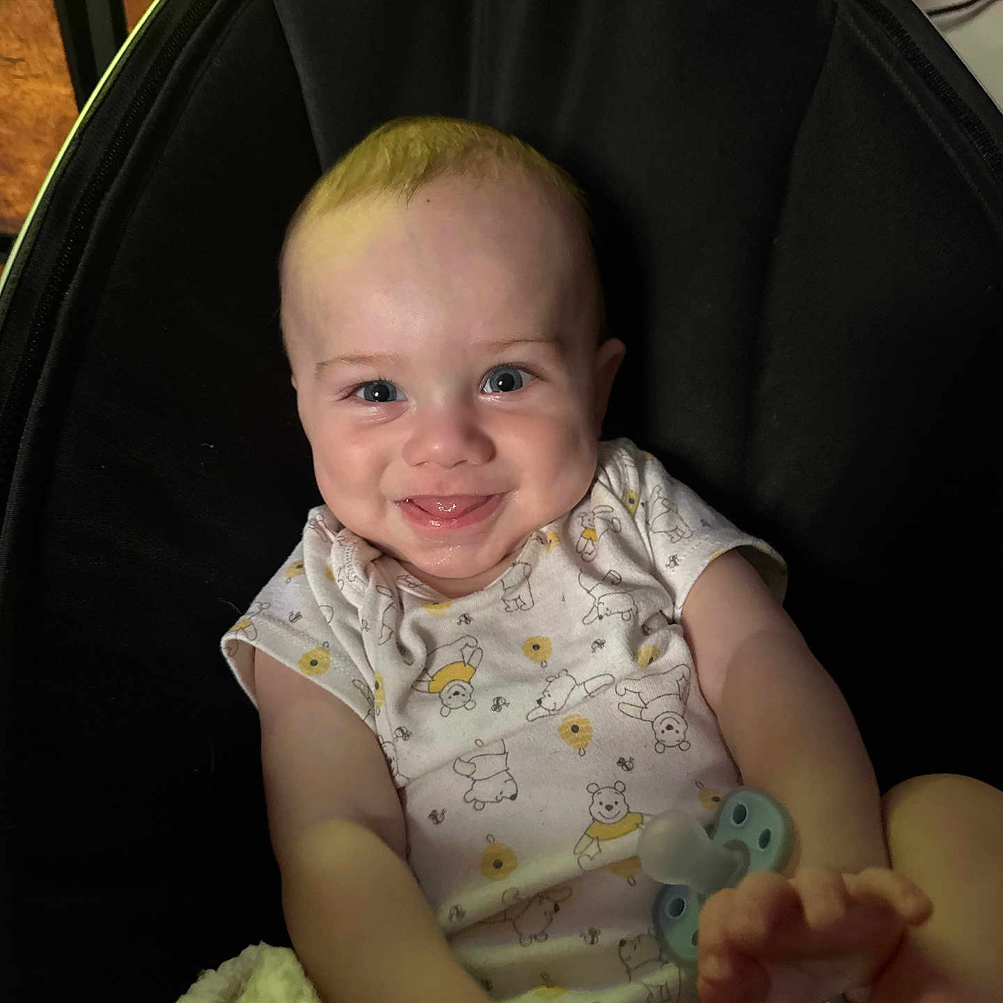 Elias joined the competition — help win amazing prizes! baby, smiling, onesie, pacifier, chair, indoor, child, cute, happy, face, infant, person, clothing, sitting, young_child, skin, head, expression, comfort, toy