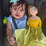 baby, blue_headband, child, childhood, clothing, cute, doll, face, hair, hand, indoor, infant, person, portrait, seatbelt, smile, soft_toy, stroller, toy, yellow_dress
