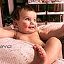 Lucas Harrison joined the competition — help win amazing prizes! baby, child, infant, bare_chest, foot, blanket, indoor, smiling, cheeks, arms, candid, cute, person, furniture, shelf, room, playful, skin, expression, young