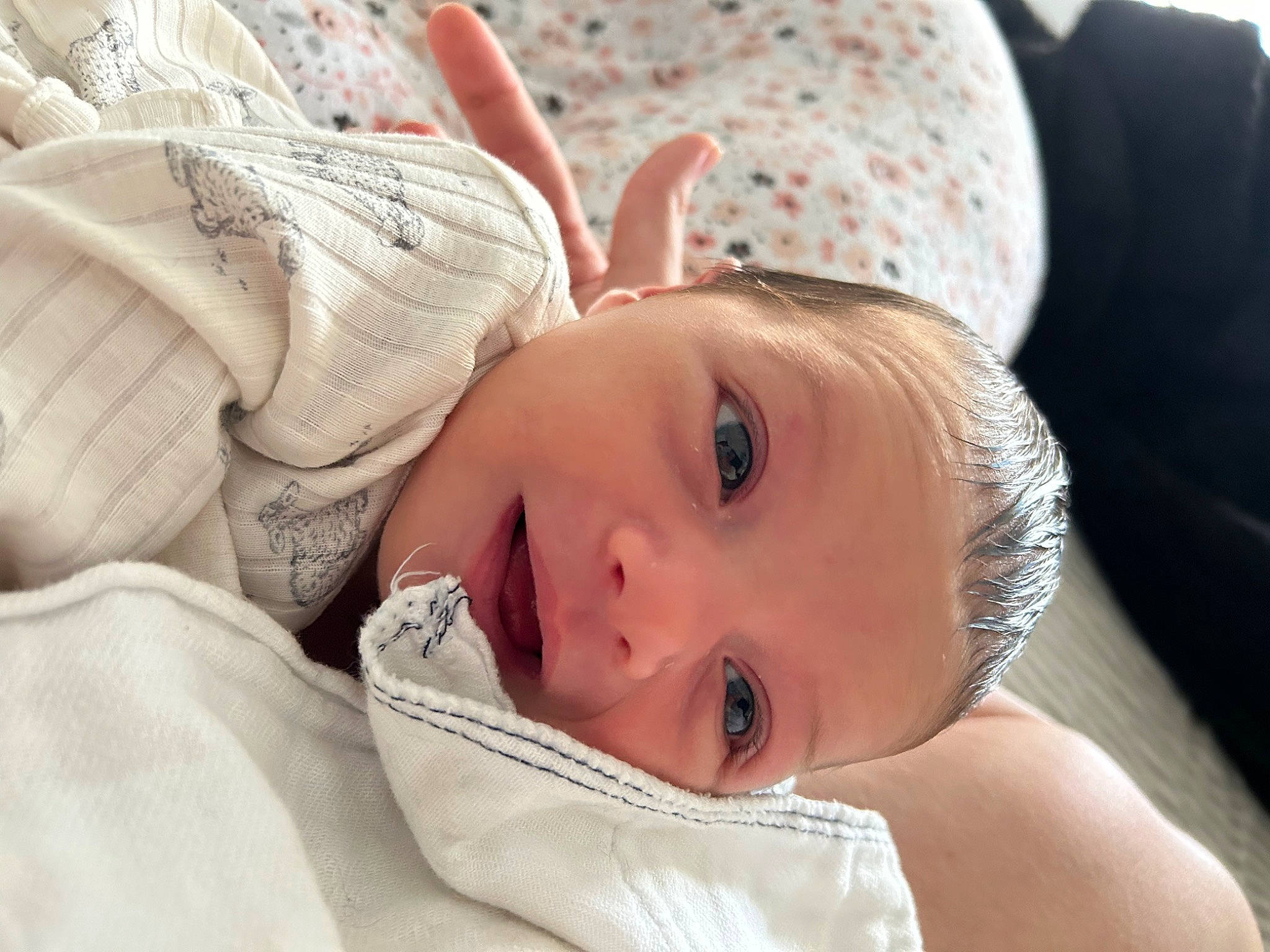 Charlotte is registered to the contest to win money with this photo: child, comfort, ear, eye, eyebrow, eyelash, face, hair, happy, head, human_body, iris, linens, lip, neck, nose, person, skin, smile, toddler