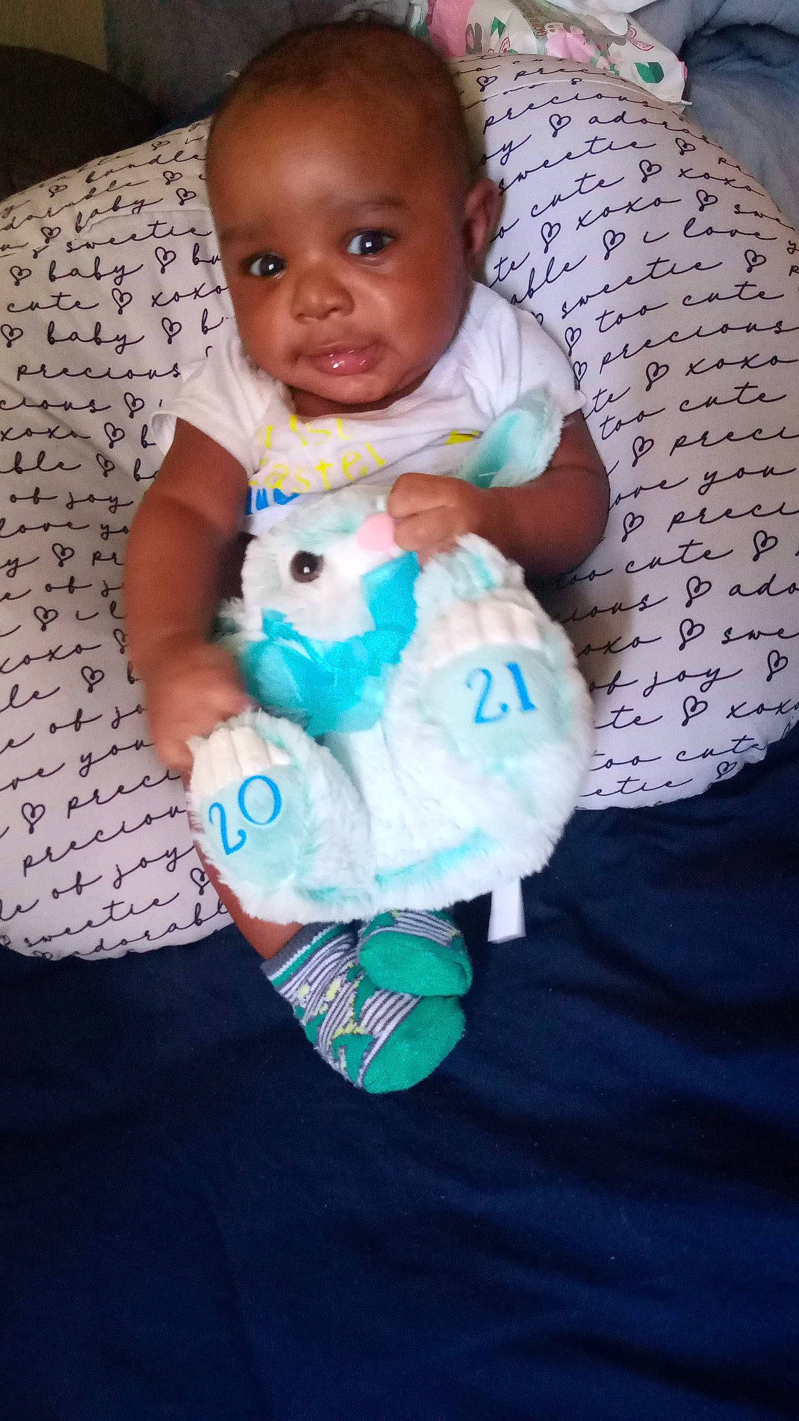 Jojo joined the competition — help win amazing prizes! baby, baby_products, baby_toddler_clothing, baby_toys, cheek, child, comfort, electric_blue, face, happy, linens, nail, pattern, person, product, room, sitting, skin, sleeve, smile