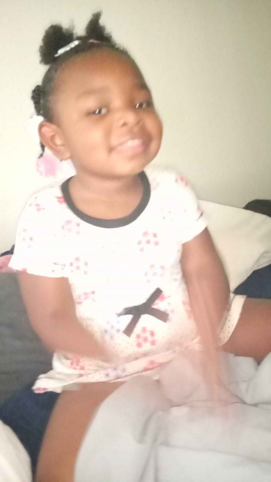 Ava is registered to the contest to win money with this photo: arm, baby_toddler_clothing, cheek, chin, dress, eyebrow, face, facial_expression, hair, hairstyle, head, joy, lip, mouth, neck, organ, person, shoulder, skin, sleeve