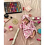 Kattaleya is registered to the contest to win money with this photo: baby, infant, pacifier, pink_robe, headband, makeup, cosmetics, brush, lipstick, eyeshadow_palette, hair_straightener, pink_background, two_months_marker, cute, lying_down, soft_fabric, skincare, beauty_products, child, portrait