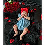 Kattaleya joined the competition — help win amazing prizes! baby, infant, blue_romper, red_headband, rose_petals, red_roses, black_fur, kiss_marks, lying_down, cute, adorable, flower_arrangement, portrait, child, skin, hand, foot, face, flower, decor