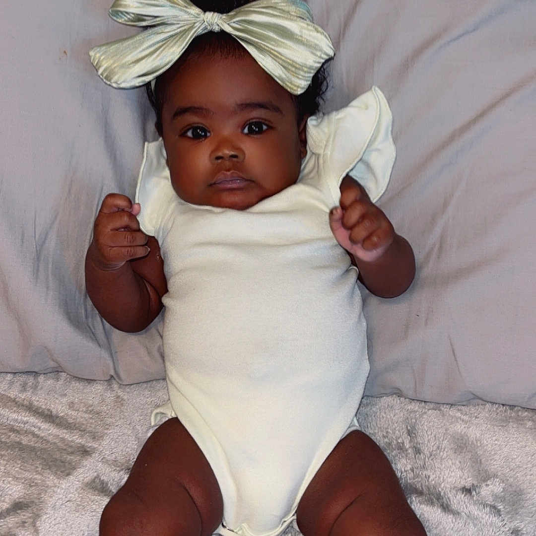 Tristan joined the competition — help win amazing prizes! appliance, baby, bed, bodypart, ceilingfan, clothing, couch, device, electricaldevice, face, finger, furniture, hand, happy, hat, head, person, photography, portrait, smile