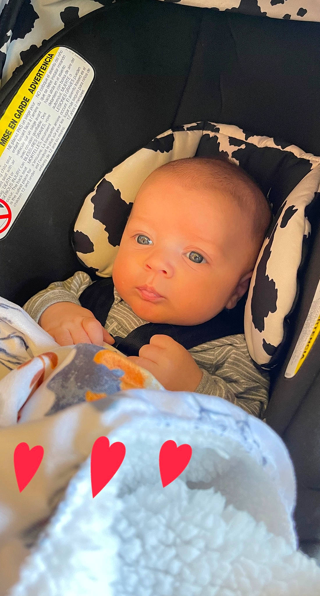 Baylor is registered to the contest to win money with this photo: baby, baby_products, baby_toddler_clothing, carmine, cheek, child, comfort, fashion_accessory, flash_photography, fun, happy, linens, organ, person, play, product, room, sitting, skin, sweetness