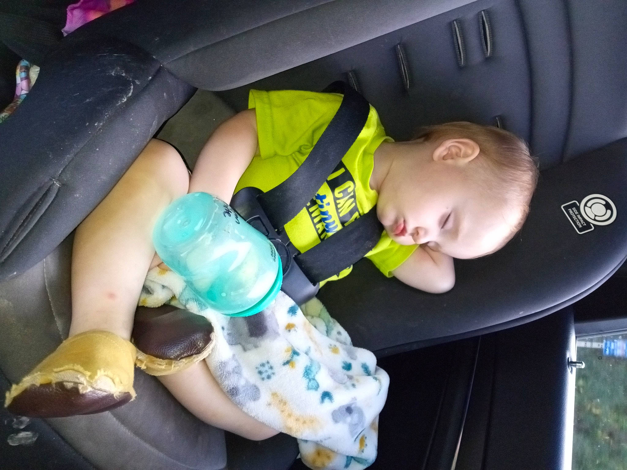 Ryan is registered to the contest to win money with this photo: arm, auto_part, automotive_design, automotive_exterior, baby, baby_products, baby_toddler_clothing, car_seat, child, comfort, finger, fun, hand, human_leg, motor_vehicle, nail, person, plastic_bottle, thumb, toddler