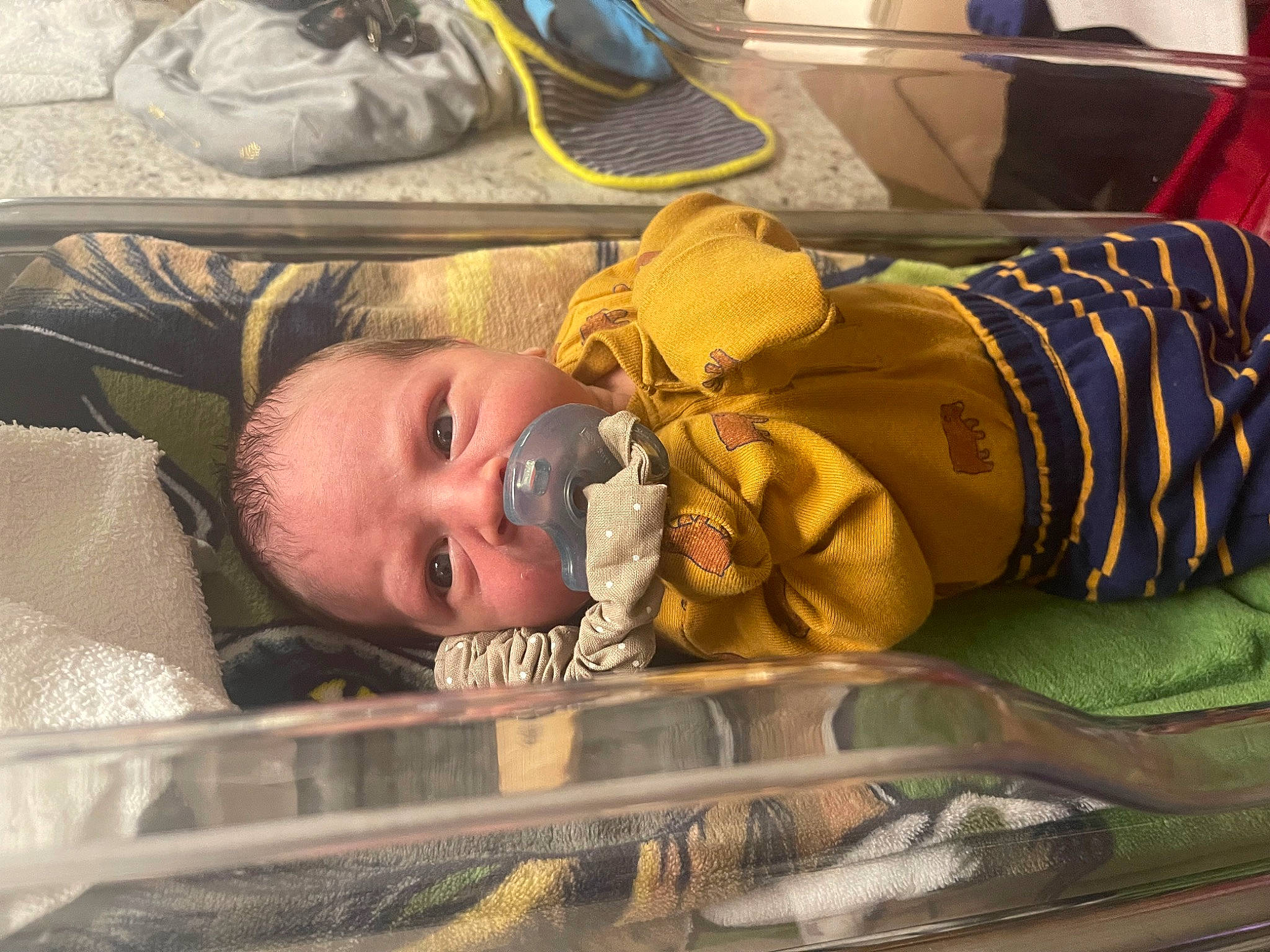 Marshall is registered to the contest to win money with this photo: baby, baby_products, baby_safety, child, comfort, flooring, infant_bed, linens, nap, person, room, sleep, toddler, walking_shoe, wood