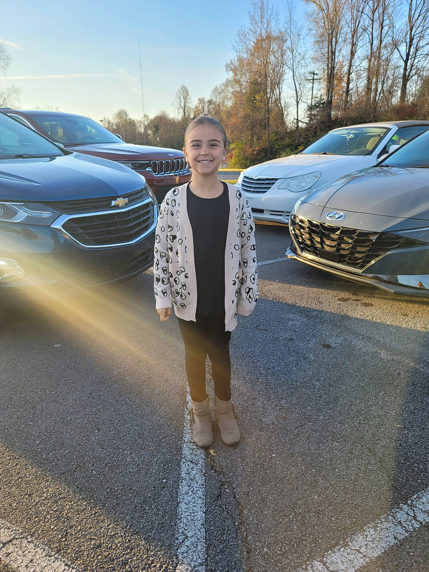 Paisley is registered to the contest to win money with this photo: asphalt, automotive_design, automotive_exterior, automotive_lighting, automotive_tire, bumper, car, grille, headlamp, hood, joy, land_vehicle, motor_vehicle, parking, person, personal_luxury_car, public_space, road_surface, sky, tire