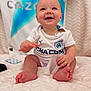Léïo participe au concours pour gagner de l'argent avec cette photo : baby, child, smiling, drool, white_jersey, sportswear, sitting, blanket, texture, blue_logo, indoor, happy, infant, cute, hand, foot, packet, clothing, portrait, person