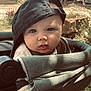 Léïo a rejoint le concours — aidez-le/la à gagner de superbes lots ! baby, child, stroller, cap, hat, face, outdoor, garden, curious, infant, portrait, cute, young, person, sunlight, nature, greenery, soft_light, closeup, expression