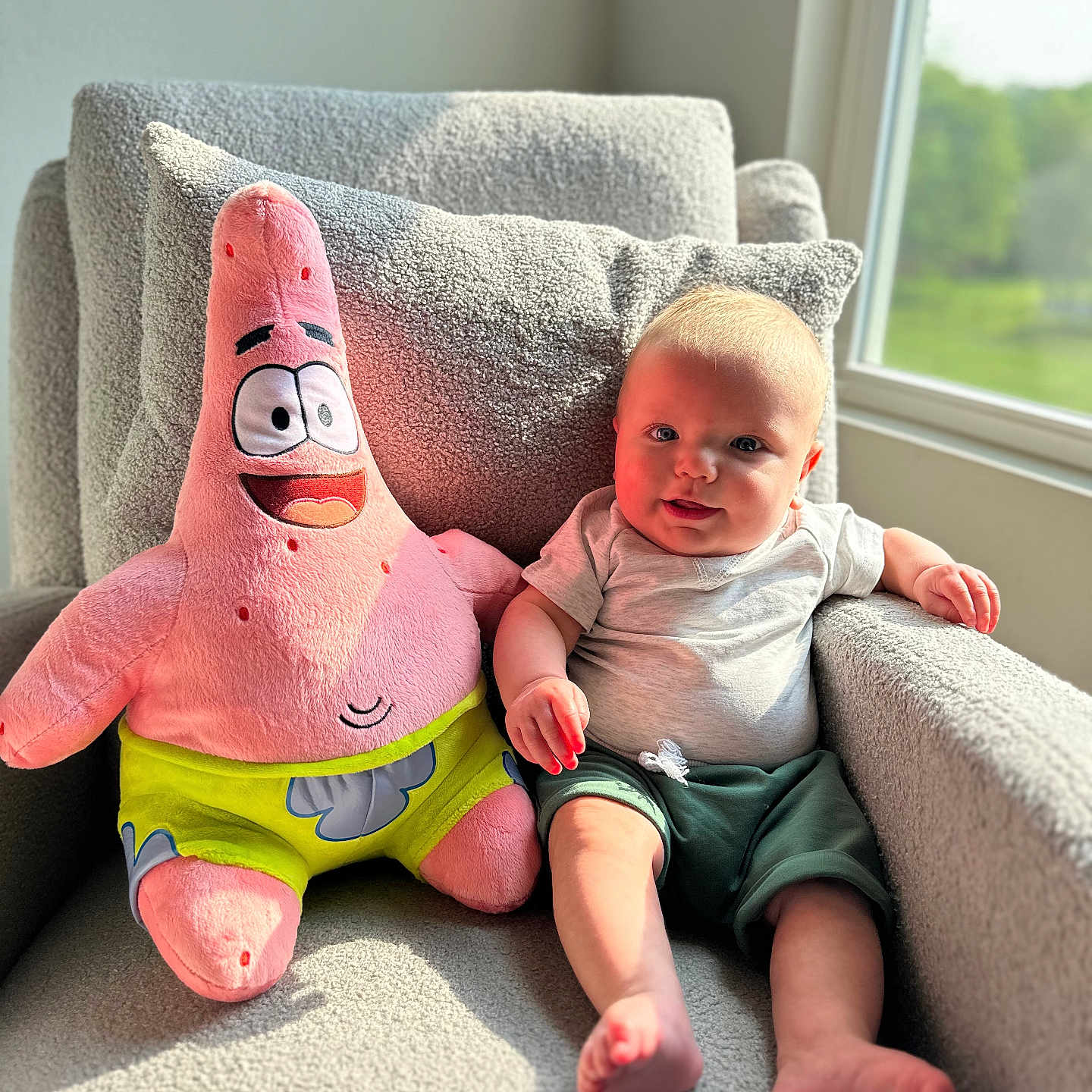 Elliott joined the competition — help win amazing prizes! architecture, baby, bodypart, building, chair, couch, cushion, face, finger, furniture, hand, head, homedecor, indoors, person, photography, plush, portrait, sitting, toy