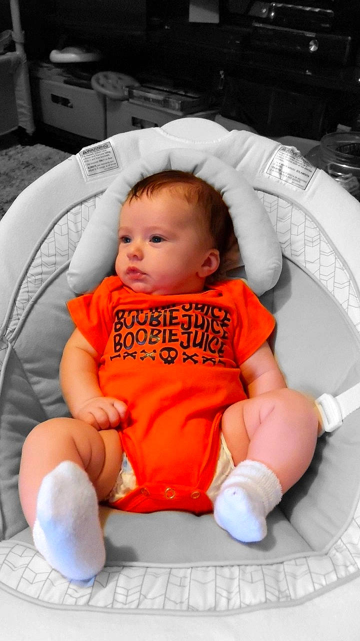 Charlie joined the competition — help win amazing prizes! baby, baby_carriage, baby_in_car_seat, baby_products, baby_toddler_clothing, cheek, child, comfort, eye, finger, hairstyle, head, lap, mouth, orange, person, sitting, skin, sleeve, toddler