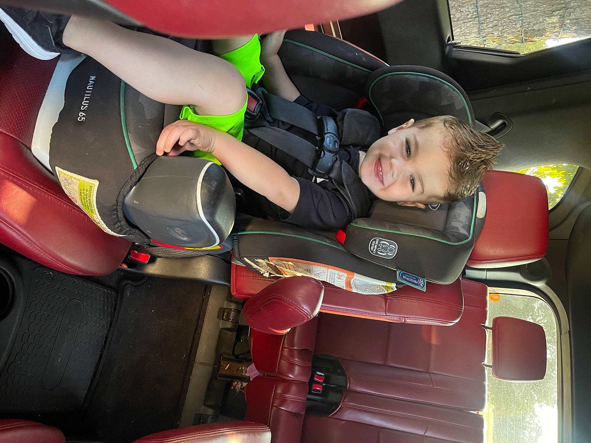Kolton is registered to the contest to win money with this photo: auto_part, automotive_design, automotive_exterior, automotive_wheel_system, car, car_seat, car_seat_cover, comfort, family_car, human_leg, joy, luxury_vehicle, motor_vehicle, person, seat_belt, steering_part, steering_wheel, thigh, toddler, vehicle