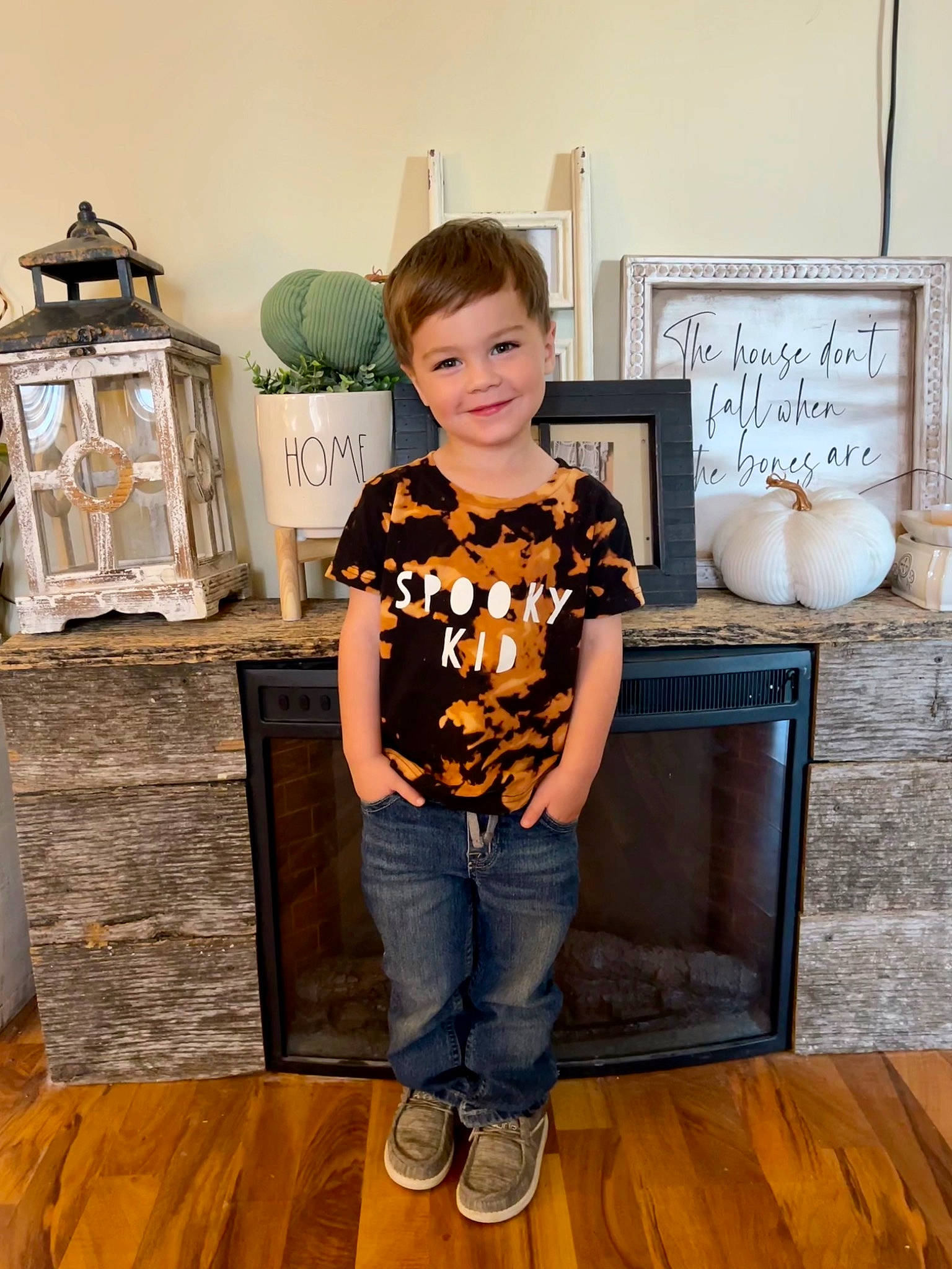 Kolton is registered to the contest to win money with this photo: child, denim, flooring, happy, hardwood, jeans, joy, laminate_flooring, pattern, person, room, sitting, sleeve, smile, standing, t_shirt, toddler, varnish, visual_arts, wood