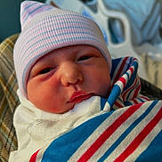 Aspen joined the competition — help win amazing prizes! newborn, baby, infant, hat, blanket, striped_blanket, hospital, bed, sleepy, face, closeup, person, cute, swaddled, child, soft_lighting, indoors, portrait, newborn_hat, hospital_room