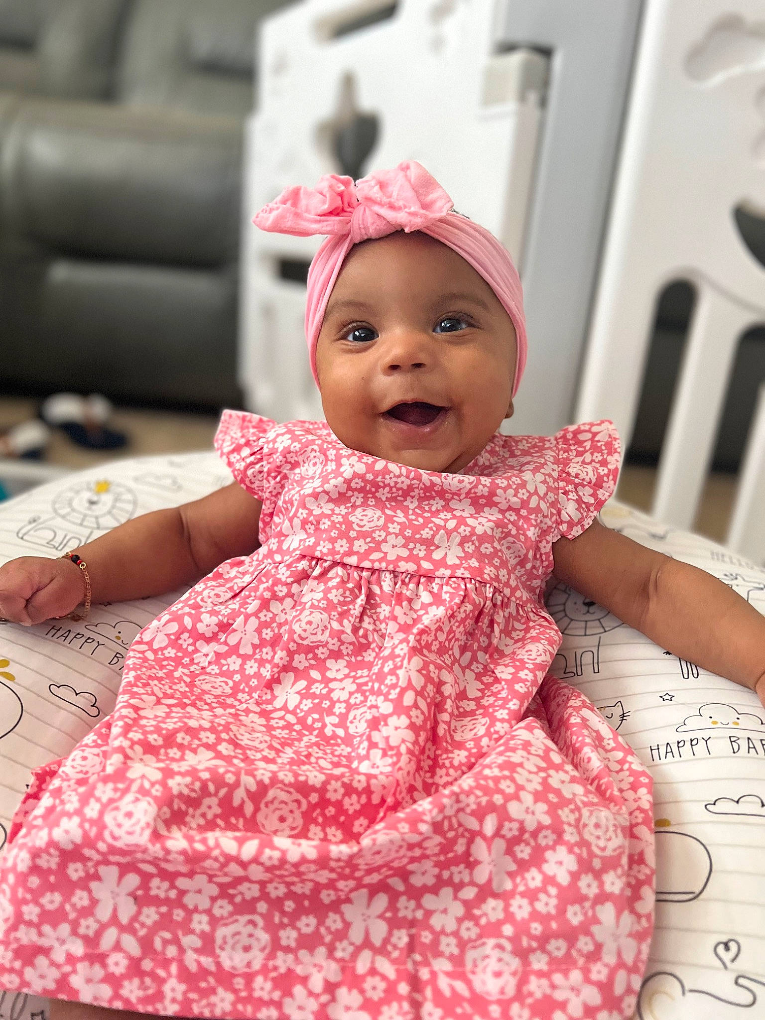 Delilah joined the competition — help win amazing prizes! baby, baby_toddler_clothing, cap, chin, clothing, dress, face, facial_expression, fun, happy, headwear, human, lip, one_piece_garment, person, pink, red, skin, sleeve, smile