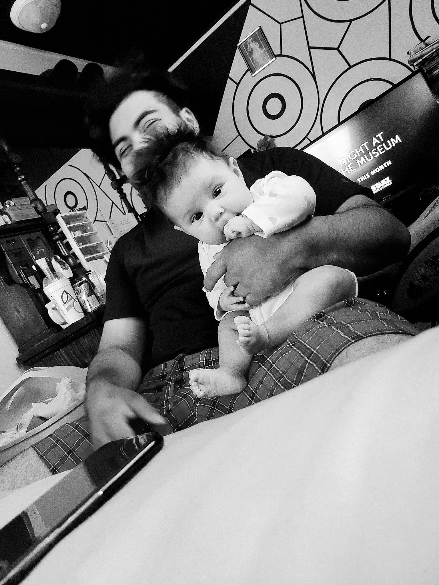 Lucia is registered to the contest to win money with this photo: arm, baby, birth, black, black_and_white, child, family, hand, leg, monochrome, monochrome_photography, people, person, photograph, photography, room, snapshot, style, technology, toddler