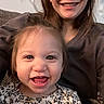 Remi is registered to the contest to win money with this photo: toddler, child, woman, smile, happy, indoor, portrait, face, person, family, joy, hair, clothing, pattern, sitting, closeup, candid, skin, head, expression