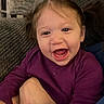 Remi joined the competition — help win amazing prizes! toddler, child, smiling, happy, face, person, purple_clothing, indoor, couch, cushion, hand, closeup, cute, young_child, portrait, baby, joy, excitement, human, expression