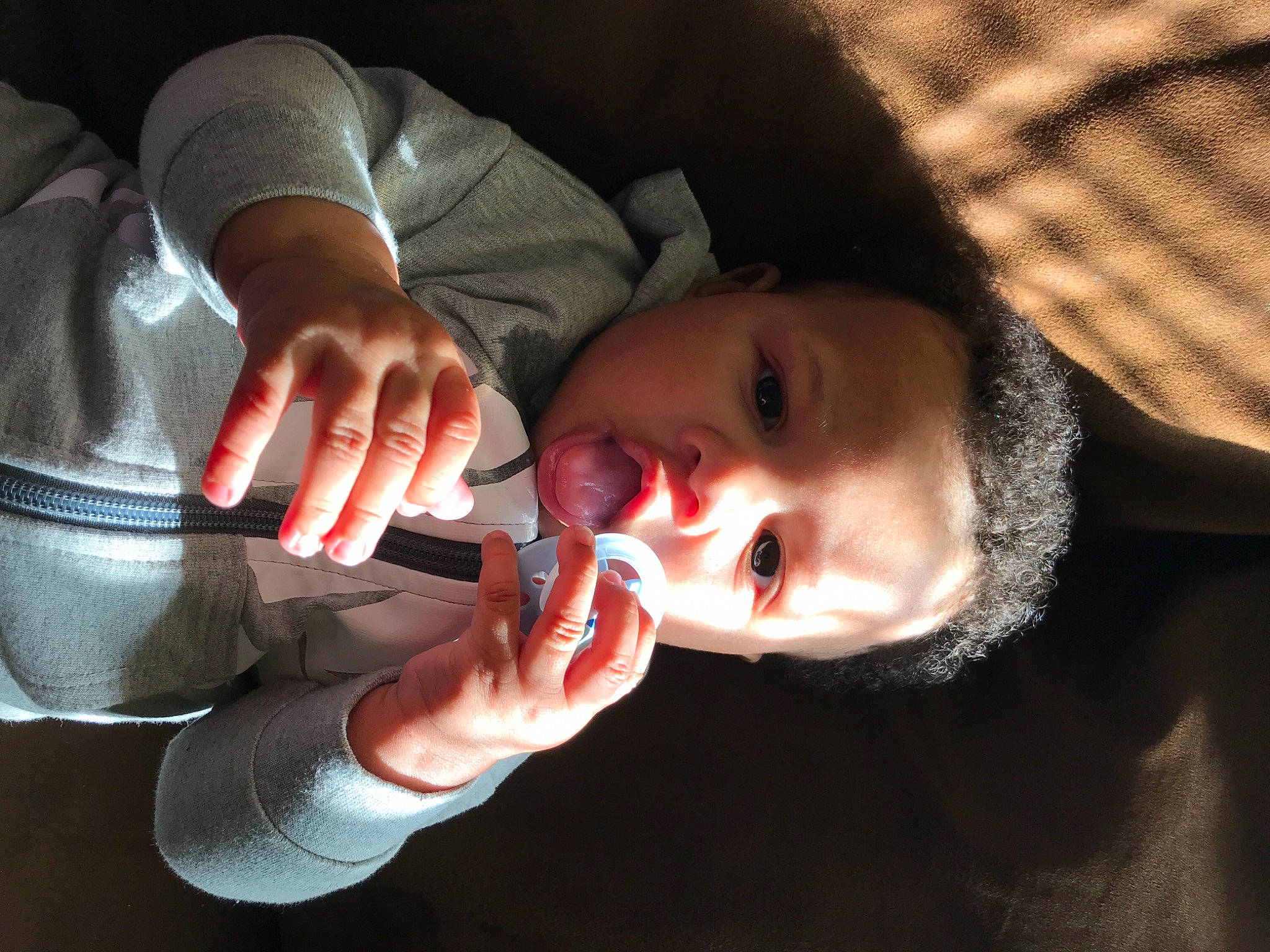 Lorenzo is registered to the contest to win money with this photo: baby, baby_toddler_clothing, cheek, dress, ear, eyebrow, eyelash, finger, flash_photography, gesture, hand, happy, human_body, iris, lip, neck, nose, person, skin, thumb