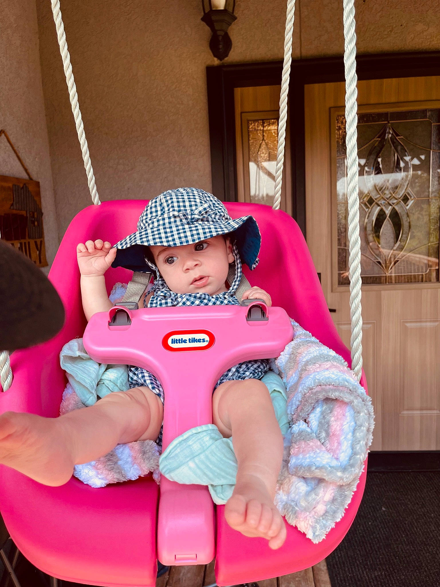 Brynlee is registered to the contest to win money with this photo: baby, baby_toddler_clothing, bag, baseball_cap, cap, child, comfort, fun, happy, hat, headwear, lap, leisure, magenta, person, pink, purple, shorts, sitting, t_shirt