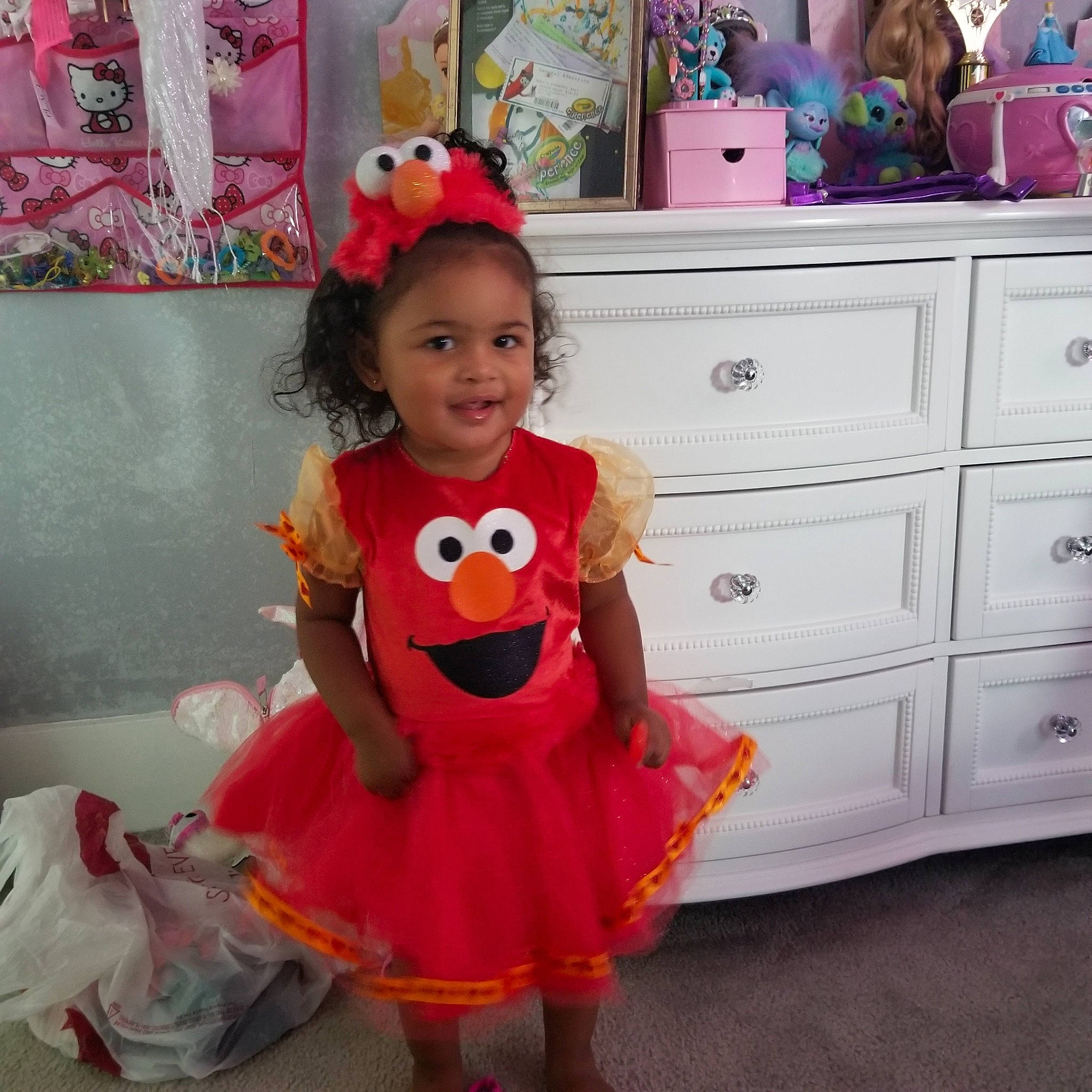 Aolani is registered to the contest to win money with this photo: baby_toddler_clothing, child, clothing, costume, peach, person, pink, play, room, smile, stuffed_toy, toddler, toy