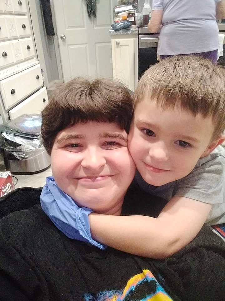 Luke is registered to the contest to win money with this photo: cabinetry, child, door, event, eye, family, fun, happy, hug, iris, joy, leisure, person, sitting, smile, t_shirt, toddler, vacation