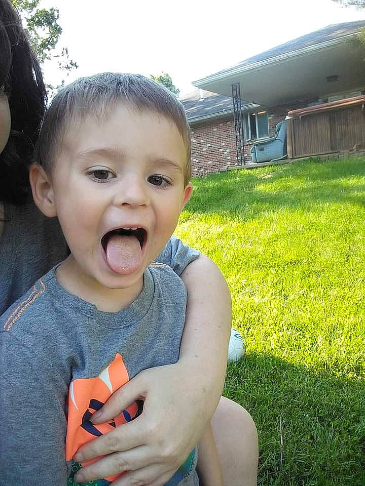 Luke is registered to the contest to win money with this photo: baby, baby_toddler_clothing, child, eyelash, gesture, grass, hand, happy, iris, leisure, lip, people_in_nature, person, plant, recreation, skin, sky, smile, thumb, toddler