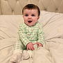 Mabel joined the competition — help win amazing prizes! baby, child, infant, pajamas, green, checkered, cherry_print, bed, bedding, white, socks, happy, smiling, portrait, indoor, cute, person, soft, headboard, sitting