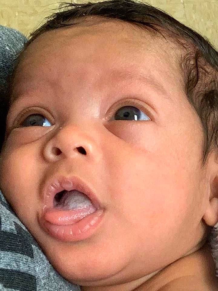 Jersey is registered to the contest to win money with this photo: baby, cheek, child, chin, close_up, ear, eyebrow, face, facial_expression, forehead, head, jaw, lip, mouth, nose, organ, person, skin, smile, surprised