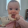 Ava participe au concours pour gagner de l'argent avec cette photo : baby, infant, teether, wooden_ring, crochet_toy, smiling, big_eyes, close_up, portrait, pajamas, pink_clothing, hand, chewing, nursery, indoor, window, natural_light, parent_hand, cute, eyelashes