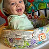 baby, child, smiling, hat, baby_seat, animal_print, colorful, toy, piano_keyboard, turtle, infant, cute, happy, indoor, face, person, playful, clothing, seat, cheerful