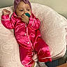 Nalani is registered to the contest to win money with this photo: baby, pacifier, pajamas, headwrap, cushion, blanket, socks, infant, indoor, resting, soft_texture, pink, child, comfort, cute, portrait, relaxed, cozy, lying_down, young_child
