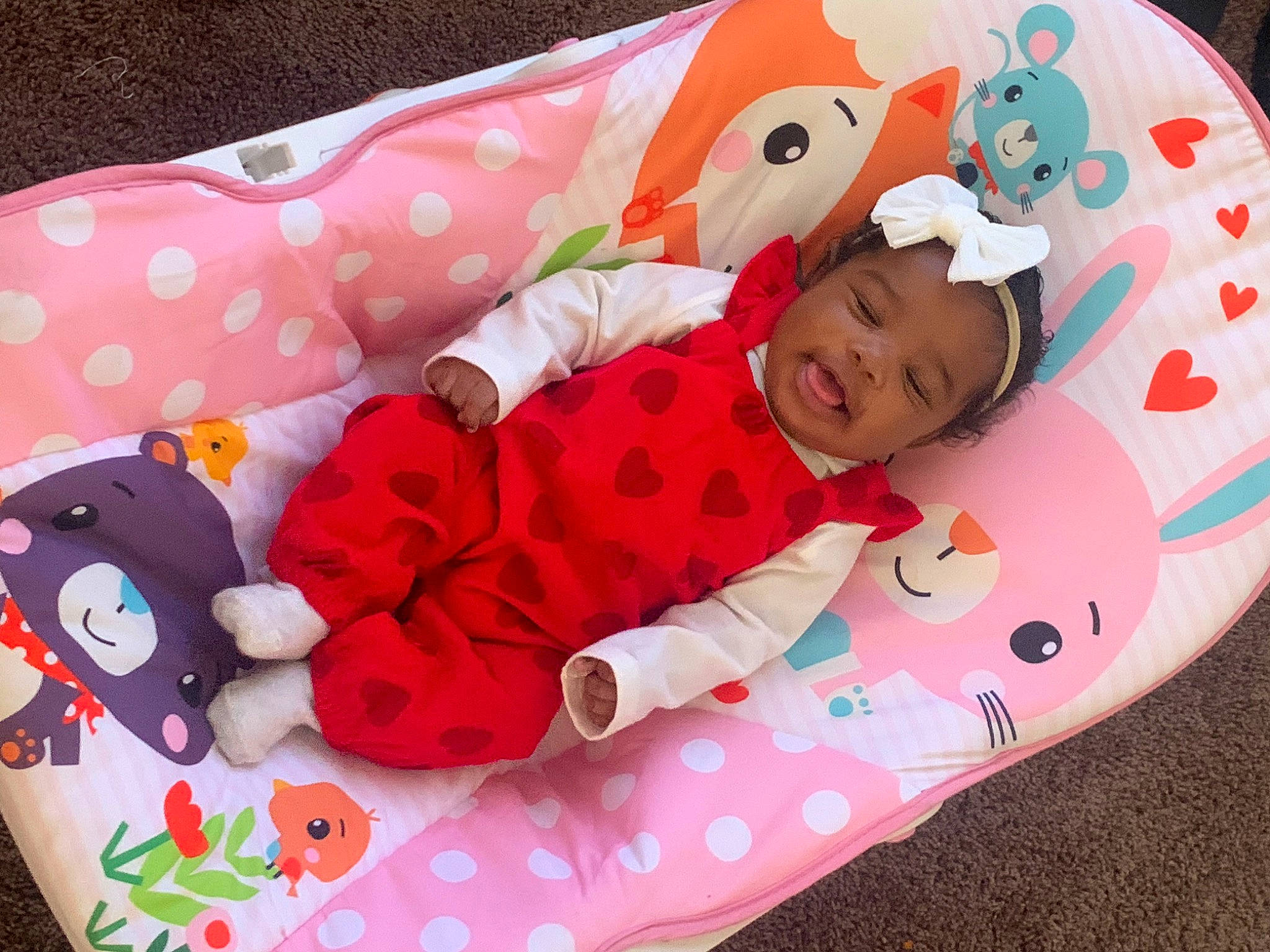 Amiyah joined the competition — help win amazing prizes! baby, baby_products, baby_toddler_clothing, bedding, cap, carmine, child, comfort, happy, headwear, linens, magenta, pattern, person, petal, pink, product, room, sleeve, smile