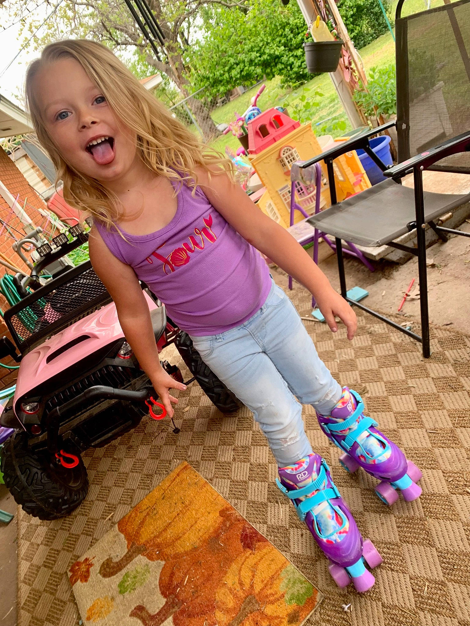 Hendrix is registered to the contest to win money with this photo: cool, fashion, flooring, fun, grass, green, happy, human_leg, knee, leisure, long_hair, luggage_and_bags, magenta, person, pink, public_space, recreation, sleeve, t_shirt, thigh