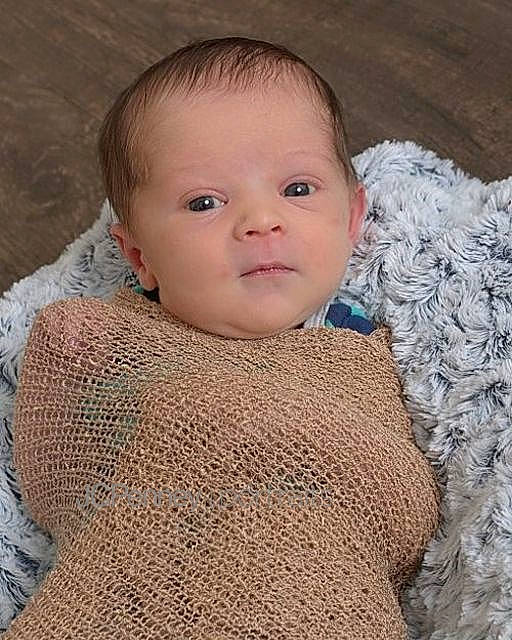 Kj is registered to the contest to win money with this photo: art, baby, cheek, child, chin, crochet, eye, face, head, iris, knitting, lip, neck, nose, outerwear, person, portrait_photography, skin, textile, toddler