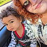 Ezra joined the competition — help win amazing prizes! woman, child, toddler, curly_hair, sunglasses, mickey_mouse, pajamas, yellow_shorts, car_interior, hand_holding, bracelets, seat, window, greenery, smile, portrait, casual_clothing, daylight, family, togetherness